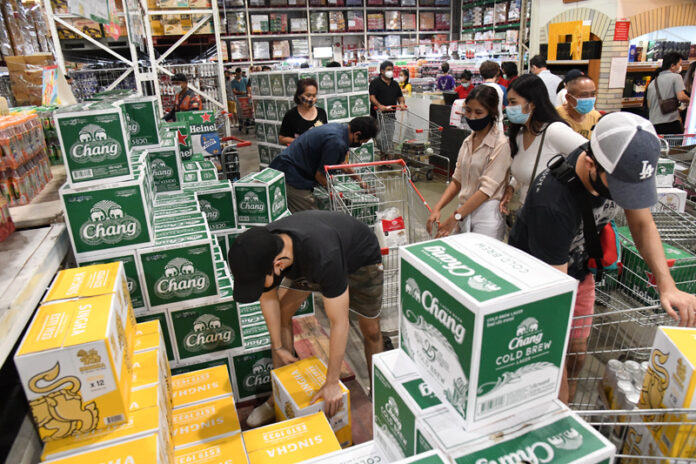 Bangkokians shop for alcohol April 9, 2020 at a branch of Makro one day before a 10-day alcohol ban comes into effect.