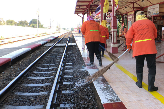 Workers disinfect Hua Hin Railway Station on April 1, 2020.