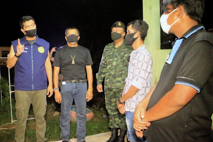 The workers, right, during their arrest at a rented house in Ranong city on April 19, 2020.