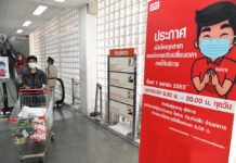 Curfew By Other Name? Bangkok Orders All Shops To Close at Midnight A sign at a Makro store in Bangkok telling customers the new business hours from 8am to 8pm.