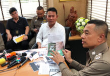 Investigators Seeking Mask Hoarding Ring Whistleblower Police presents evidence to Sornsuvee Puraweeratwatcharee during his arrest on March 9, 2020.