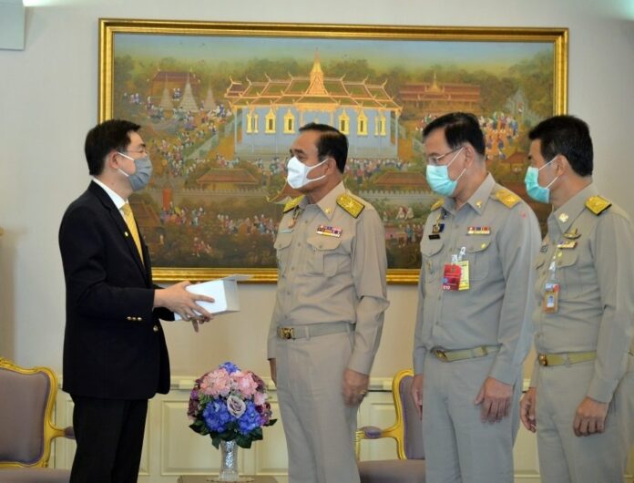 PM Prayut Chan-o-cha and government officials at Government House on March 30, 2020.
