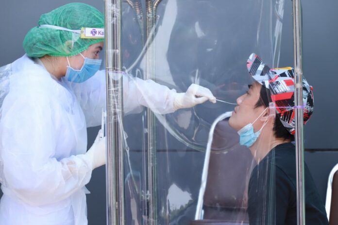 A man gets a COVID-19 test on April 9, 2020 at Kasemrad Hospital Ramkhamhaeng.