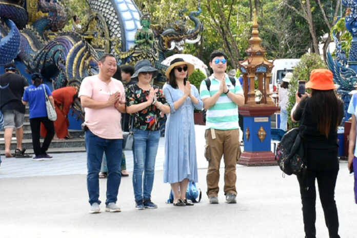 Chinese tourists pose for photos in Chiang Rai province on Oct. 3, 2019.