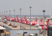 Prayut Threatens to Ban All Public Transport to Stop Pandemic Grounded planes at Don Mueang International Airport.