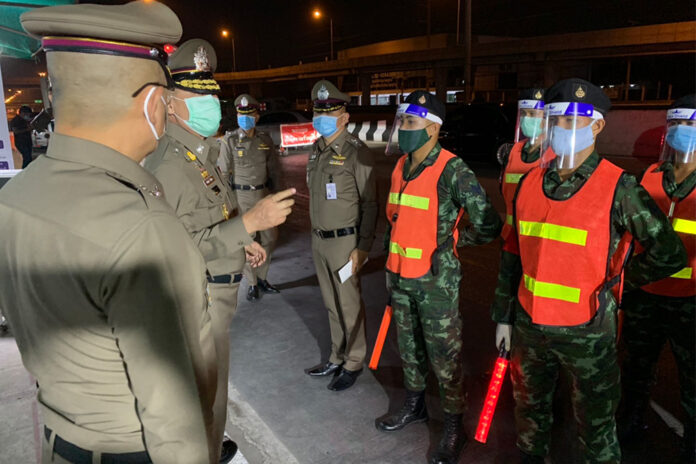 Police commissioner Chakthip Chaijinda inspects a checkpoint in Nonthaburi province on April 15, 2020.
