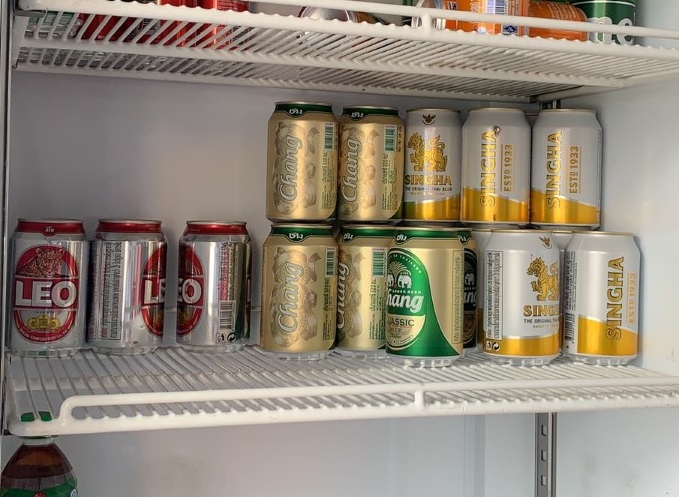 Cans of beer are seen inside a grocery store's fridge in Chonburi province on April 12, 2020. 100,000 Thais Face Severe Alcohol Withdrawal During Virus Booze Ban