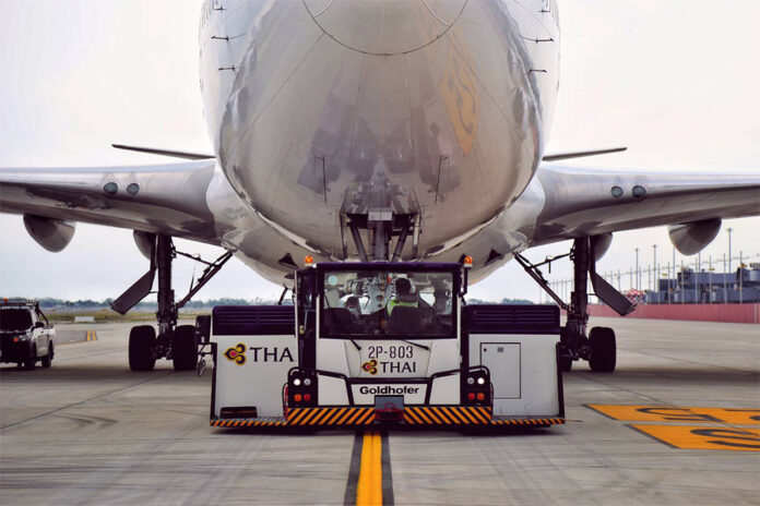 A Thai Airways aircraft being towed to a parking bay at Suvarnabhumi Airport.