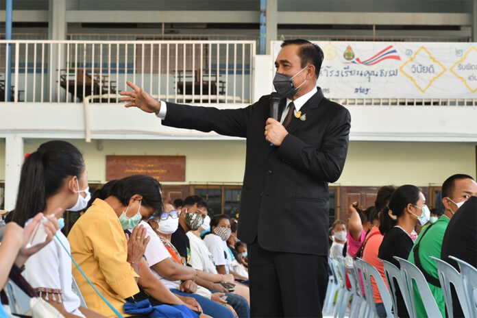 Prime Minister Prayut Chan-o-cha during his visit to Wat Rakhang Khositaram to inspect COVID-19 relief measures on May 13, 2020.