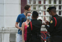 Gov’t Reports Only One New Virus Case, Credits Mask Wearing A woman gets her temperature checked before entering Lumpini Park on May 3, 2020.