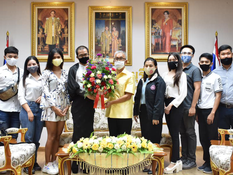 Members of the LGBT community give flowers to Chanthaburi governor Witurat Srinam as a token of appreciation on June 14, 2020.