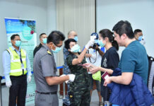 Pandemic ‘Travel Bubble’ to Admit Some Chinese Tourists A traveler gets her temperature checked at Surat Thani Airport on Feb. 1, 2020.