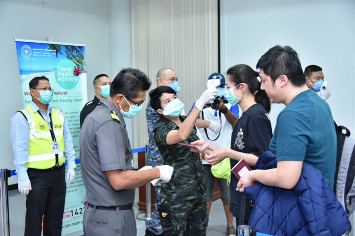 A traveler gets her temperature checked at Surat Thani Airport on Feb. 1, 2020.