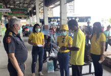 Bus Operator Confirms Ban on Foreign Travelers in Pandemic A passenger fills out a questionnaire before boarding a bus at Korat Bus Terminal on June 8, 2020.