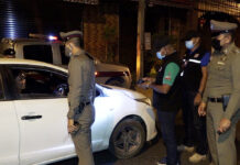 Trial Period: Army Proposes Lifting Curfew For 15 Days Security officials inspect a vehicle at a checkpoint on Samui Island.