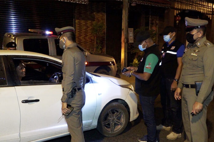 Security officials inspect a vehicle at a checkpoint on Samui Island.