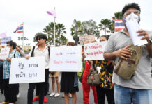 Top Gov’t Officials Split on Extending the Virus Emergency Law Activists in front of the Government House on June 18, 2020.