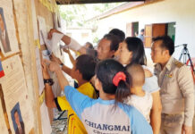 PM Promises Local Elections This Year, But No Money for Them Yet A file photo of people checking the names of eligible voters for an election.