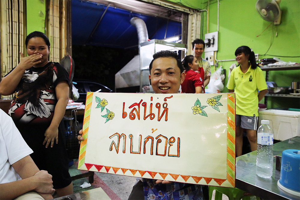 Sanea Bandasak shows the shop's original sign.