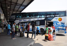 Gov’t May Lift All Pandemic Travel Restrictions This Weekend Passengers wait for intercity buses at Korat Bus Terminal on April 8, 2020.