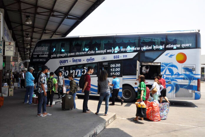 Passengers wait for intercity buses at Korat Bus Terminal on April 8, 2020.