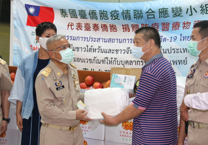 A Taiwanese businessman donates fruits and face masks to the Phayao governor so that they can be placed in donation boxes at Phayao City Hall on May 25, 2020.
