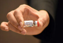 Researchers Eye Human Trials of Coronavirus Vaccine in Oct. A vial of prototype COVID-19 vaccine is shown to the media on June 22, 2020.