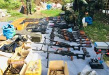 Police Say Tak Weapon Cache Linked to ‘Political Group’ A photo released by the police shows a pile of weapons allegedly seized during a raid in Tak province on June 23, 2020.