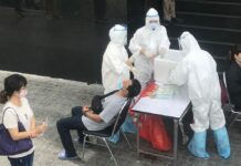 Hospital Finds Virus Case Outside Quarantine: Officials Rayong residents line up to take coronavirus tests on July 15, 2020.