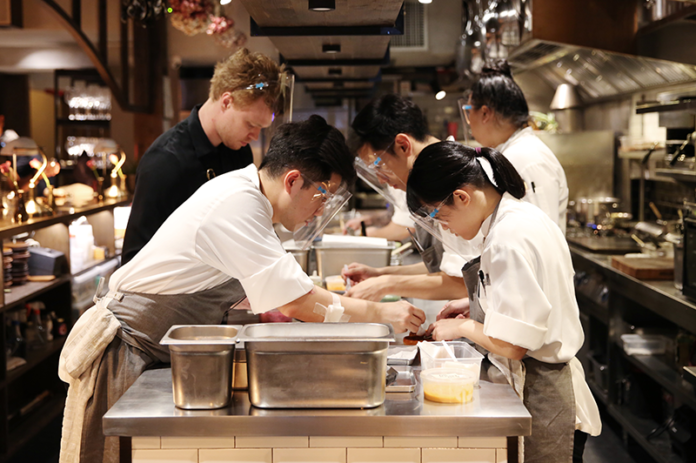 Kitchen staff wear face shields at Canvas in July 2020.