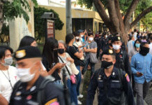 Memo Shows Cops Preparing for Student Protest Arrests Riot police walk past protesters at an anti-government rally at the Democracy Monument on July 18, 2020.