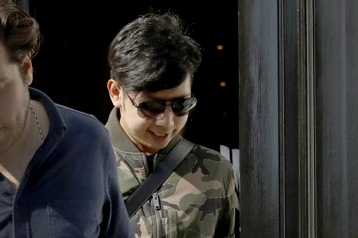 In this April 5, 2017, file photo, Vorayuth "Boss" Yoovidhya, whose grandfather co-founded energy drink company Red Bull, walks to get in a car as he leaves a house in London. Photo: Matt Dunham, File / AP
