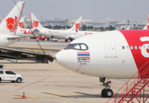 Thai-China Flights With Infected Pax Stop in Bangkok for Refuel A file photo of Thai Lion Air and Thai AirAsia X aircrafts at Don Mueang International Airport.