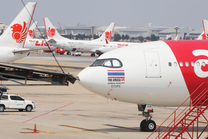 A file photo of Thai Lion Air and Thai AirAsia X aircrafts at Don Mueang International Airport.