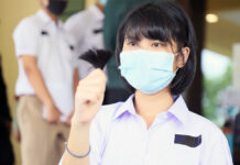 Schools Still Ignore Gov’t Revised Haircut Rule A student activist holds a trimmed hair during a protest at the Ministry of Education on July 3, 2020.