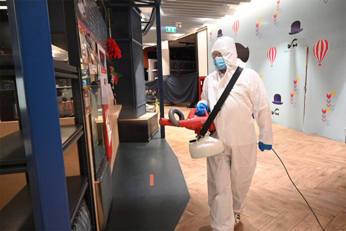 A worker disinfects Central Plaza Rayong on July 14, 2020.