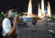 Students to Stage More Anti-Prayut Rallies Across Thailand An activist speaks at a "gardening watching event" close to Democracy Monument on July 21, 2020.
