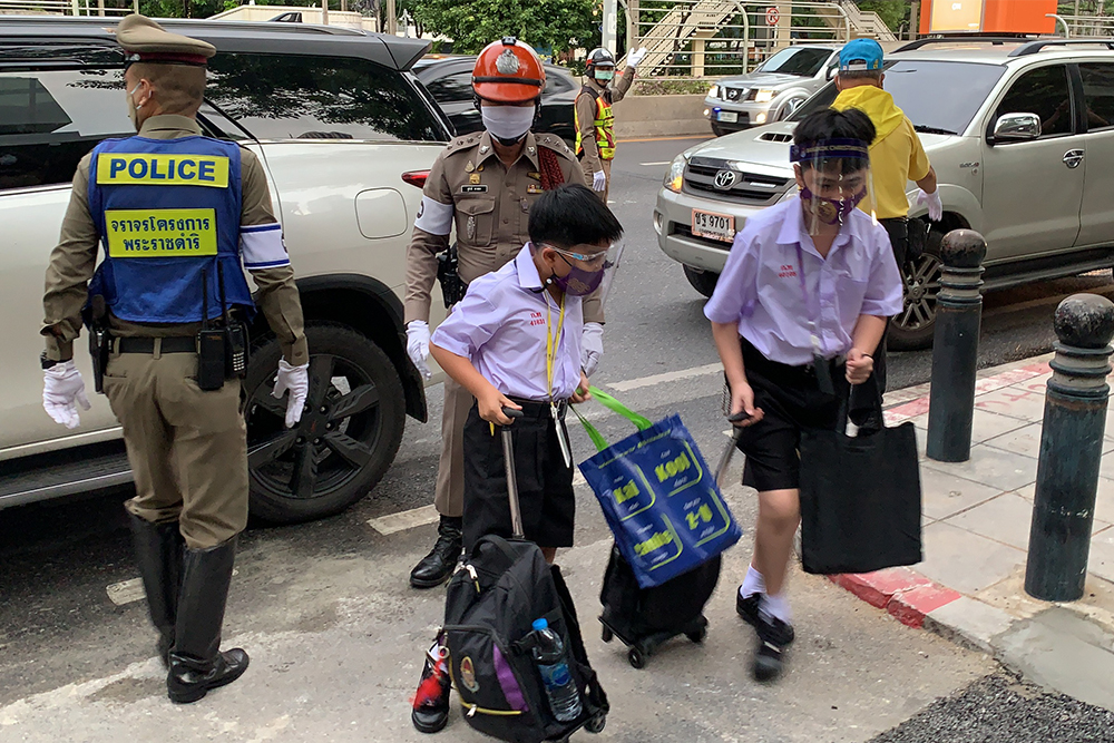 Traffic cops are deployed in front of the Bangkok Christian School in Bangkok.