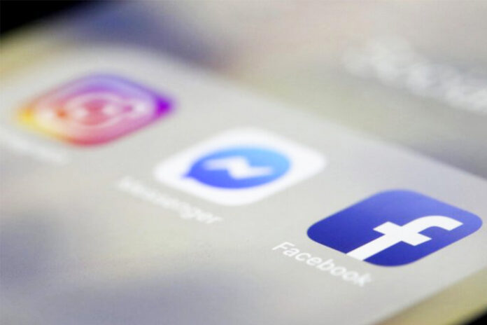 A file photo of Facebook, Messenger and Instagram apps displayed on an iPhone. Photo: Jenny Kane / AP
