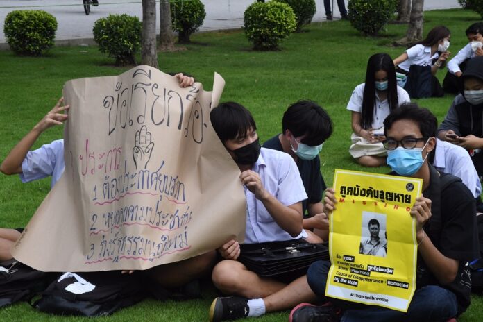 Anti-government protesters rally at the University of Chamber of Commerce on Aug. 11, 2020.