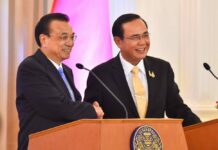 Sino-Thai Trade Continues to Grow Despite Pandemic Chinese Premier Li Keqiang shakes hands with PM Prayut Chan-o-cha at Government House in Bangkok on Nov. 5, 2019.