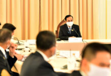 Emergency Rule Stamps Out Virus and Civil Rights Alike: Experts PM Prayut Chan-o-cha chairs a government's pandemic response center meeting on May 15, 2020.