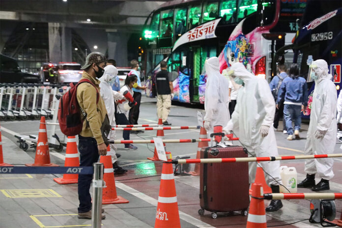 Health officials disinfect luggages at Suvarnabhumi Airport on Aug. 13, 2020.