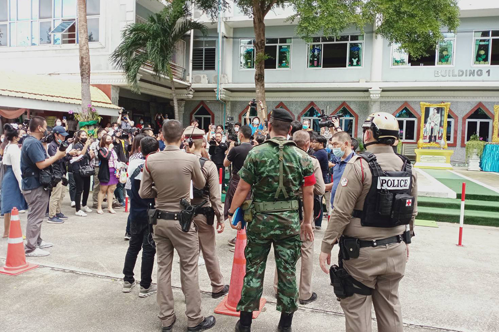 Security officials stand guard at the school.