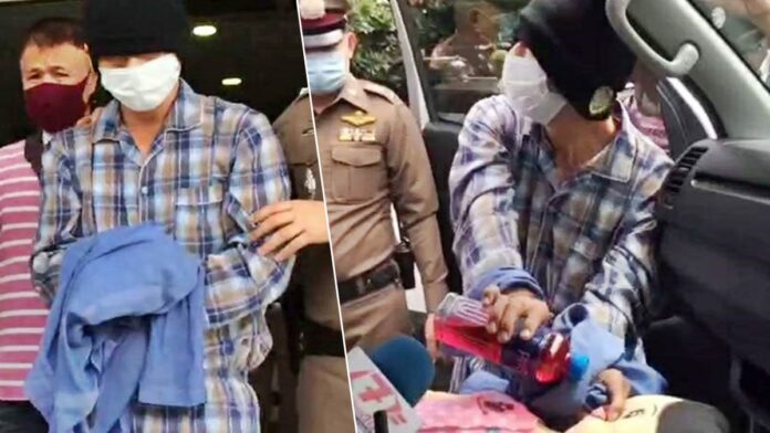 Anuphap Jaipanya in a police reenactment Sept. 24, 2020 of the murder of his daughter.
