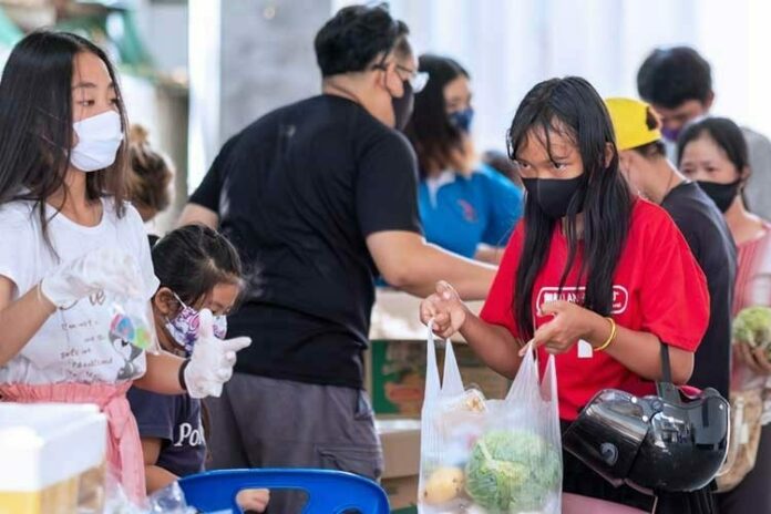 A file photo of people wearing masks in public space.