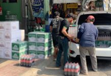 Trade Group Urges Gov’t to Rethink Banning Online Booze Sales A man in Sisaket province loads crates of beer and soda water into a vehicle on May 3, 2020. The image was censored due to legal concerns.