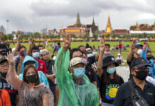 Opinion: Is the First Chapter of the Monarchy-Reform Struggle Ending? Pro-democracy protesters raise a three-finger salute during a rally at Sanam Luang on Sept. 20, 2020. Photo: Gemunu Amarasinghe / AP