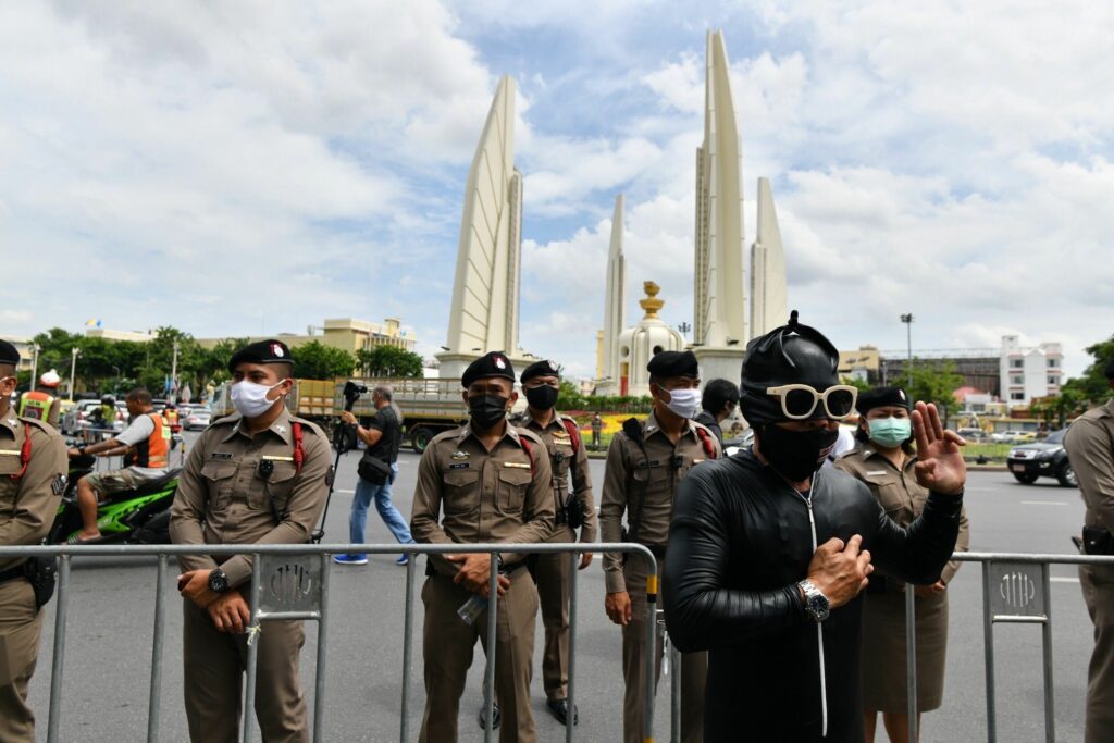 Police stand guard at the Democracy Monument on Aug. 16, 2020.