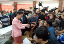 Kindergarten Violence Scandal: Director Says Parents Just Want Money Parents surround deputy education minister Kanokwan Wilawan during a meeting at Sarasas Witaed Ratchaphruek School on Sept. 29, 2020.